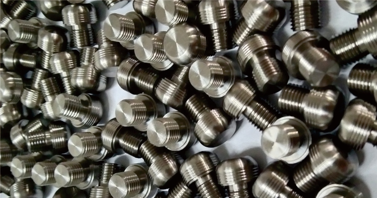 Titanium fasteners including custom screws and precision fastening components